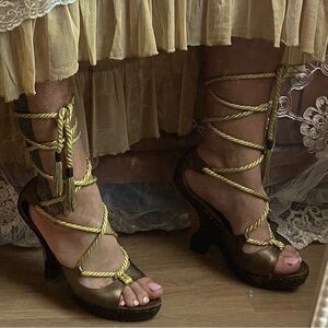 Sz9 Beyoncé’s House of Deréon gold, lace up, platform heels.